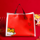 虎年礼品袋新年喜庆福牛红色手提塑料袋年货送礼过年礼物包装袋子
