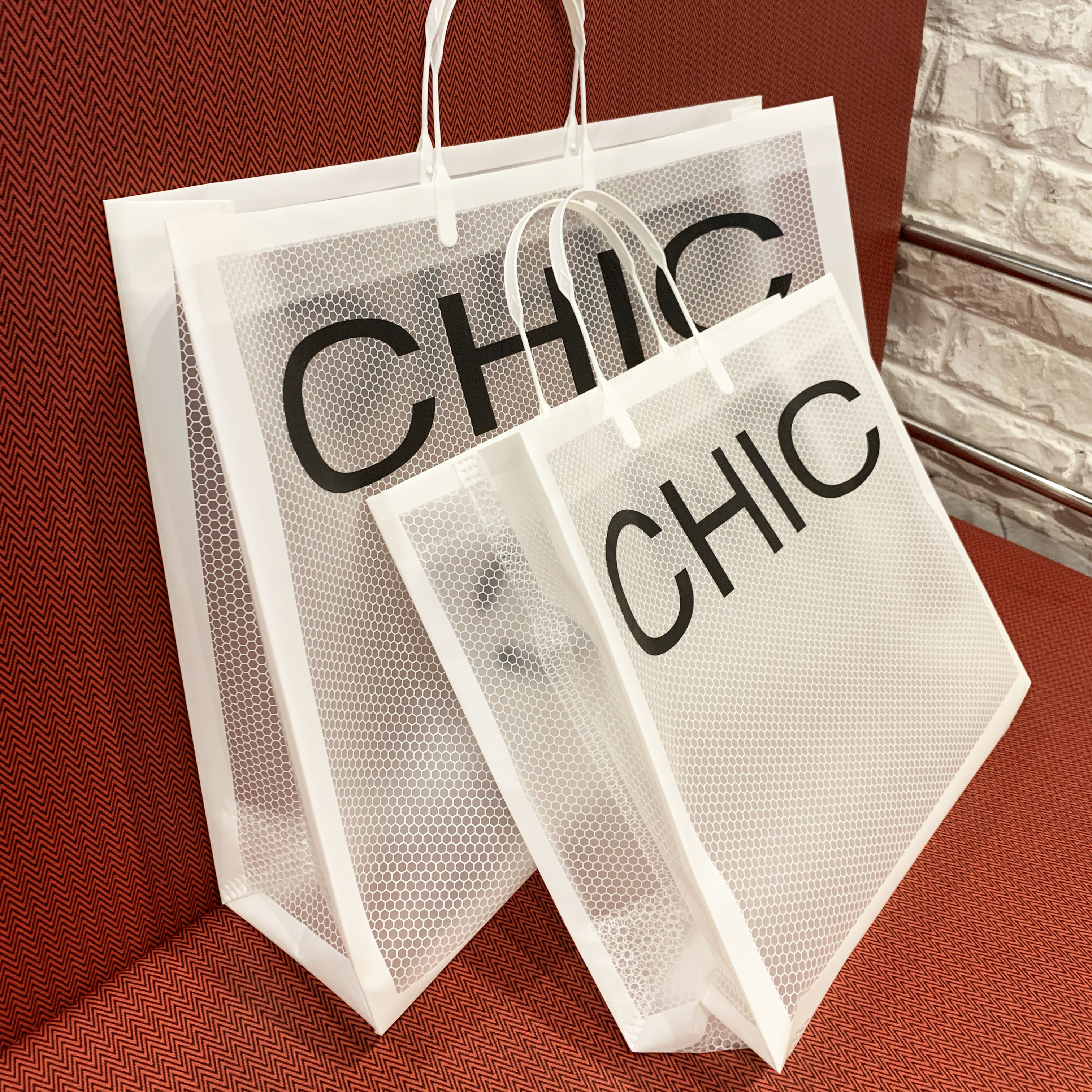 服装店手提袋塑料礼品礼物袋子pvc大号衣服包装购物定制logo优惠券