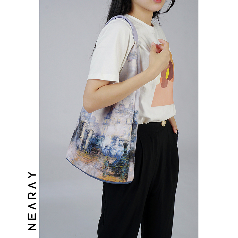 莫奈油画单肩包新款时尚手提水桶包女印花浪漫文艺大容量帆布包包