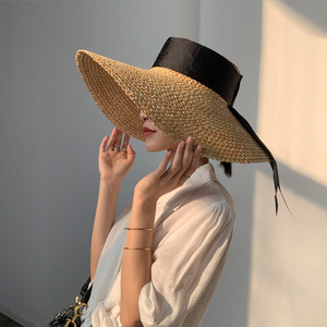 时尚大檐遮阳帽草帽假沙滩图片