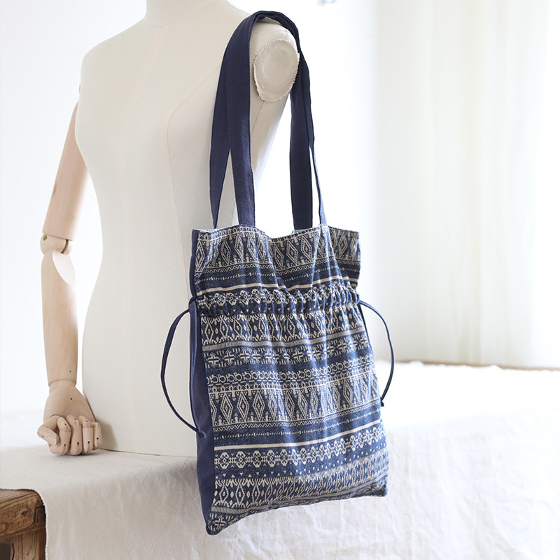 庸庸原创抽绳束口包女单肩包复古帆布包民族风小众设计布包大学生