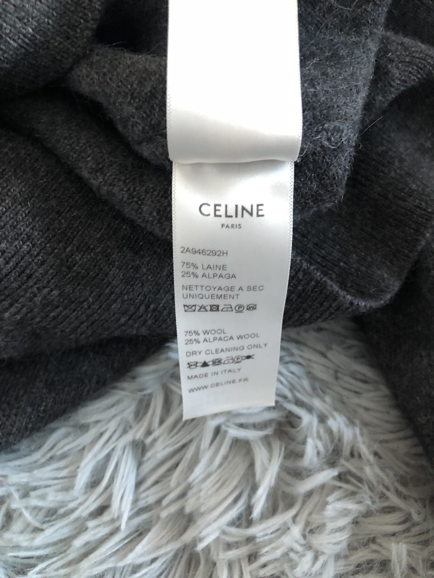 Celine Ruffled High Neck Sweater — label
