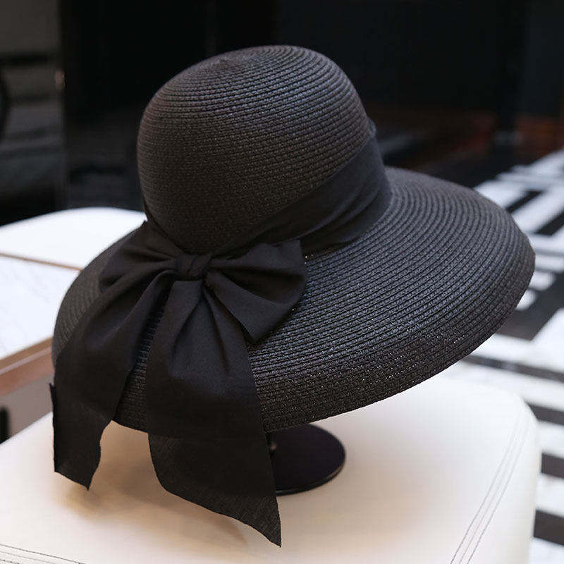果果帽饰夏季新品遮阳帽赫本风黑色出游时尚海边沙滩大檐草帽子女蝴蝶