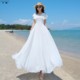 白色连衣裙女2025夏新款气质超仙高级感绝美海边穿搭沙滩裙长款