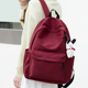 初中女生书包高中大学生背包小众大容量2024新款红色双肩包旅行包