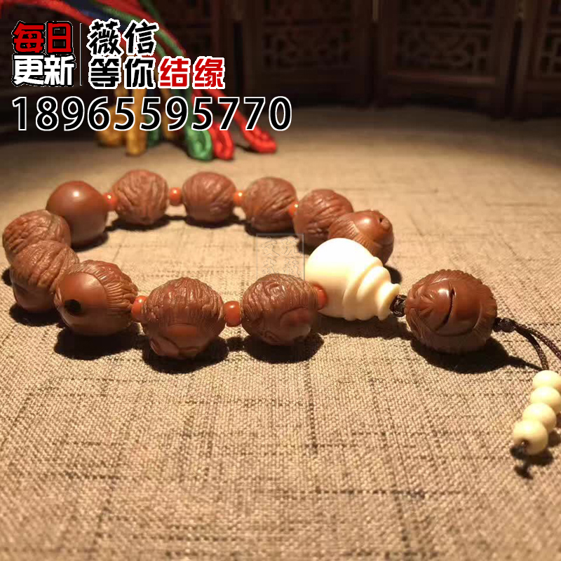 文玩金丝小猴头正圆橄榄核桃纯手工雕刻大圣金刚光珠