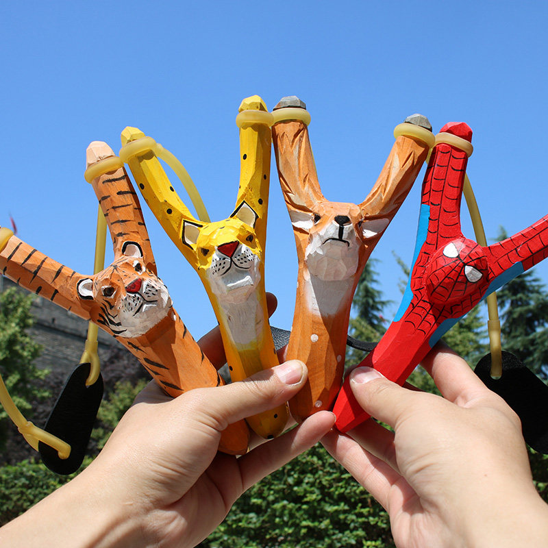 弹弓木_创意儿童玩具弹弓传统卡通手工木雕动物射击户外送泥丸男孩