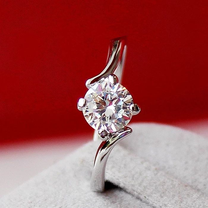 一折婚礼戒指对戒 仿真金_日韩时尚简约四爪仿真钻1克拉戒指扭臂钻石