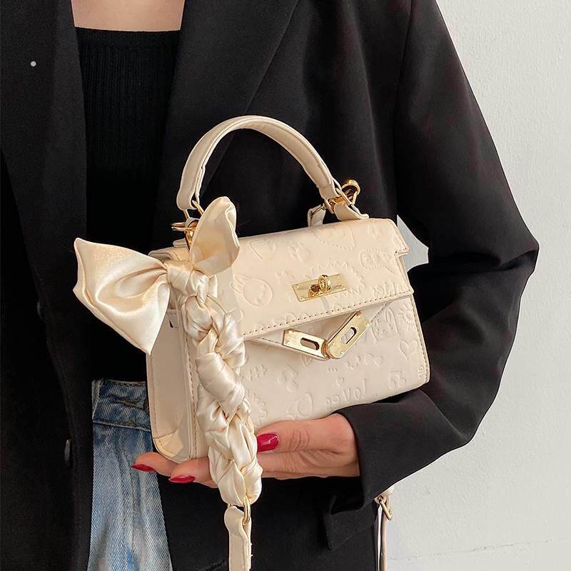 美国mkifashion小包包女今年流行高级感斜挎百搭手提迷你凯莉包