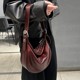 牛皮黑色腋下包包2025新款女士高级质感通勤马鞍饺子包单肩斜挎包