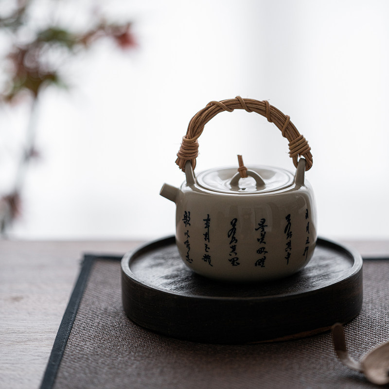 草木祠草木灰小提梁壶手写诗文藤编提梁壶泡茶壶带过滤陶瓷茶壶