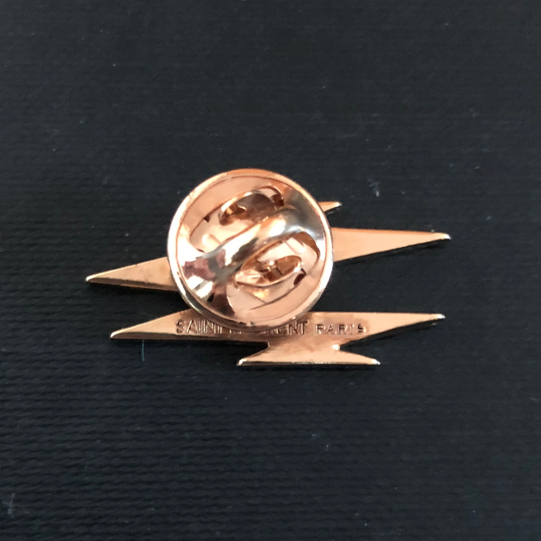 Saint Laurent Lipstick Lighter Shield Brooch — label