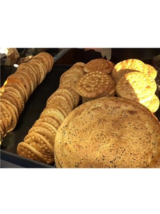 新疆馕饼机 大型打馕机 制馕机器馕饼成型机烤包子皮机披萨饼底机