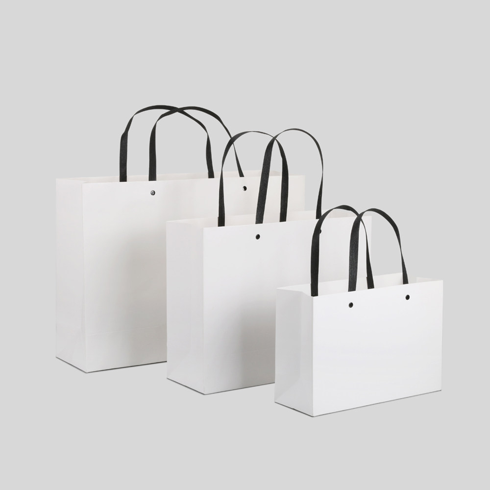 白色敲钉礼品袋彩印 卡纸服装袋手提袋礼品包装纸袋定制印刷logo