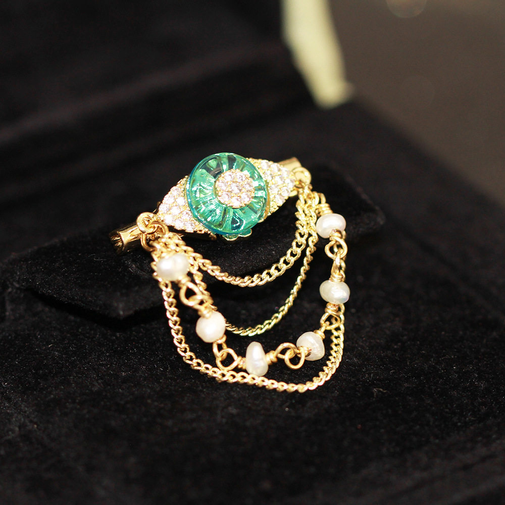 恶魔之眼高档胸针女奢华气质天然珍珠流苏链条别针职业装大衣配饰