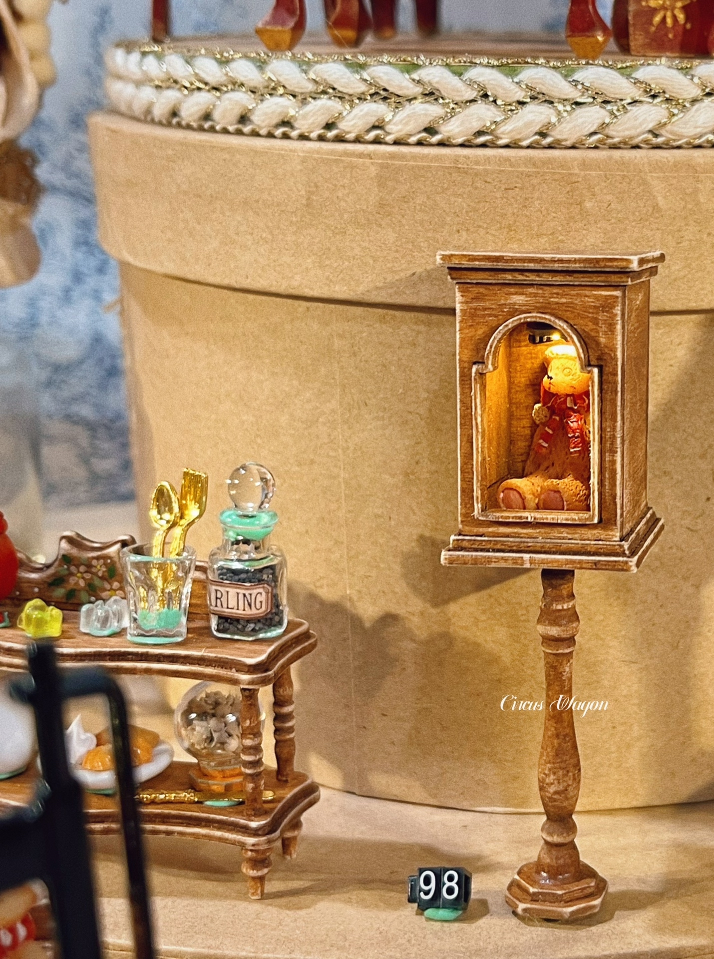 Close-up of 1:12 scale miniature shelf with lighting