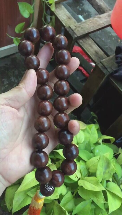 极品海南黄紫油花梨，车挂佛珠。尺寸2.0cm*22颗。