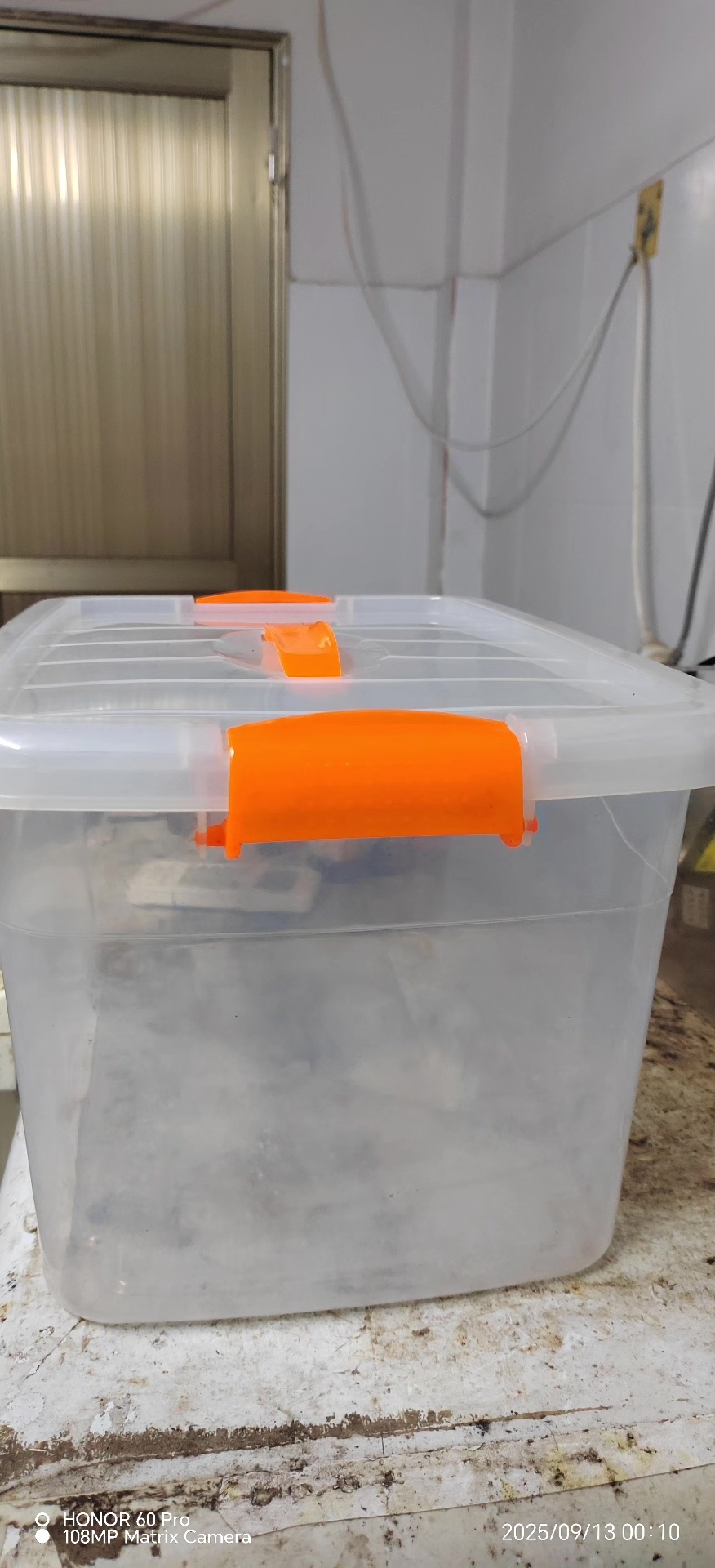 A transparent collection box, orange handles, PP material, sealed button design...