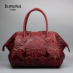 B．MUTUS/执古真皮女包头层牛皮复古中国风压花玫瑰手提包