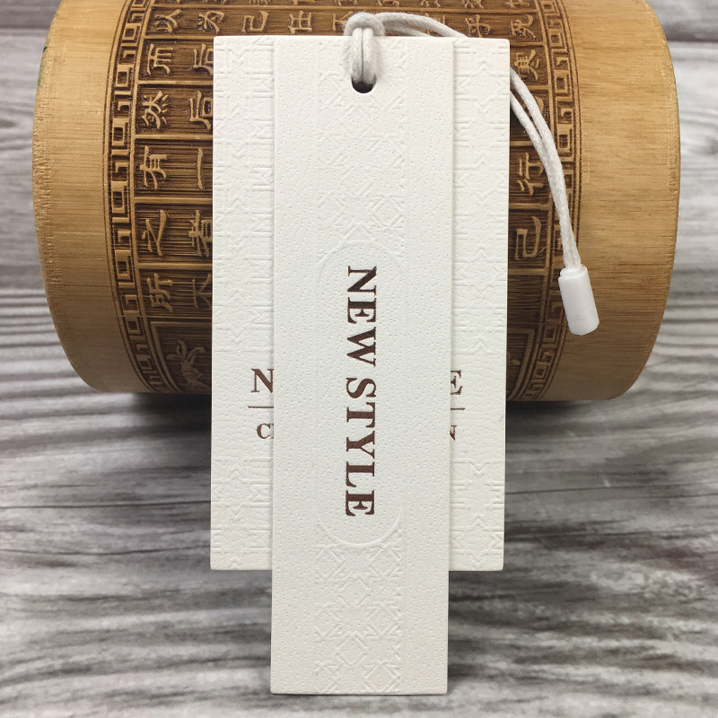 高档特种纸加加厚烫金压纹凹凸现货服装吊牌吊粒