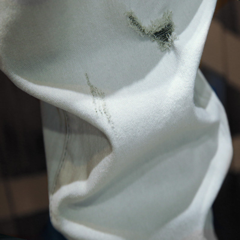 2022新款白色破洞牛仔裤九分潮牌修身小脚裤子牛仔裤