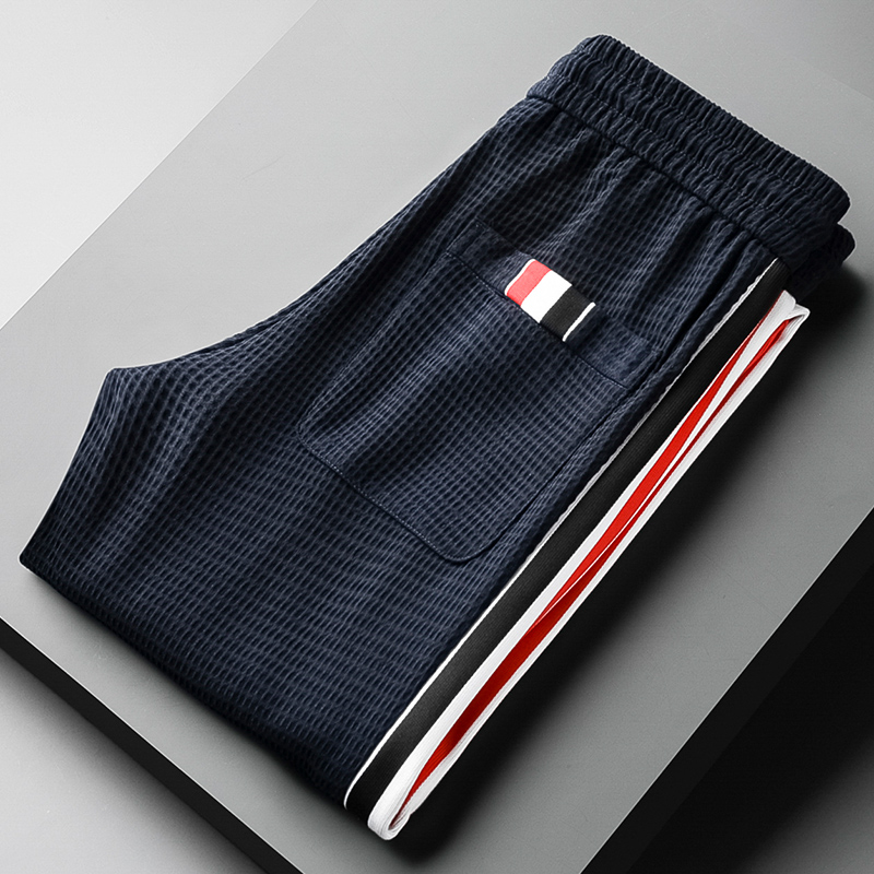 华夫格高级感卫裤薄款冰丝裤网格休闲运动裤侧边织带潮流束脚男士