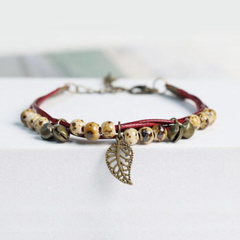 ສາຍແຂນກະດິ່ງເຊລາມິກທີ່ມີໃບນ້ອຍແບບຊົນເຜົ່າ braided ສາຍແຂນສໍາລັບເດັກຍິງ niche ໃຫມ່ອອກແບບດອກໄມ້ glaze bestie bracelet ສໍາລັບເດັກຊາຍ