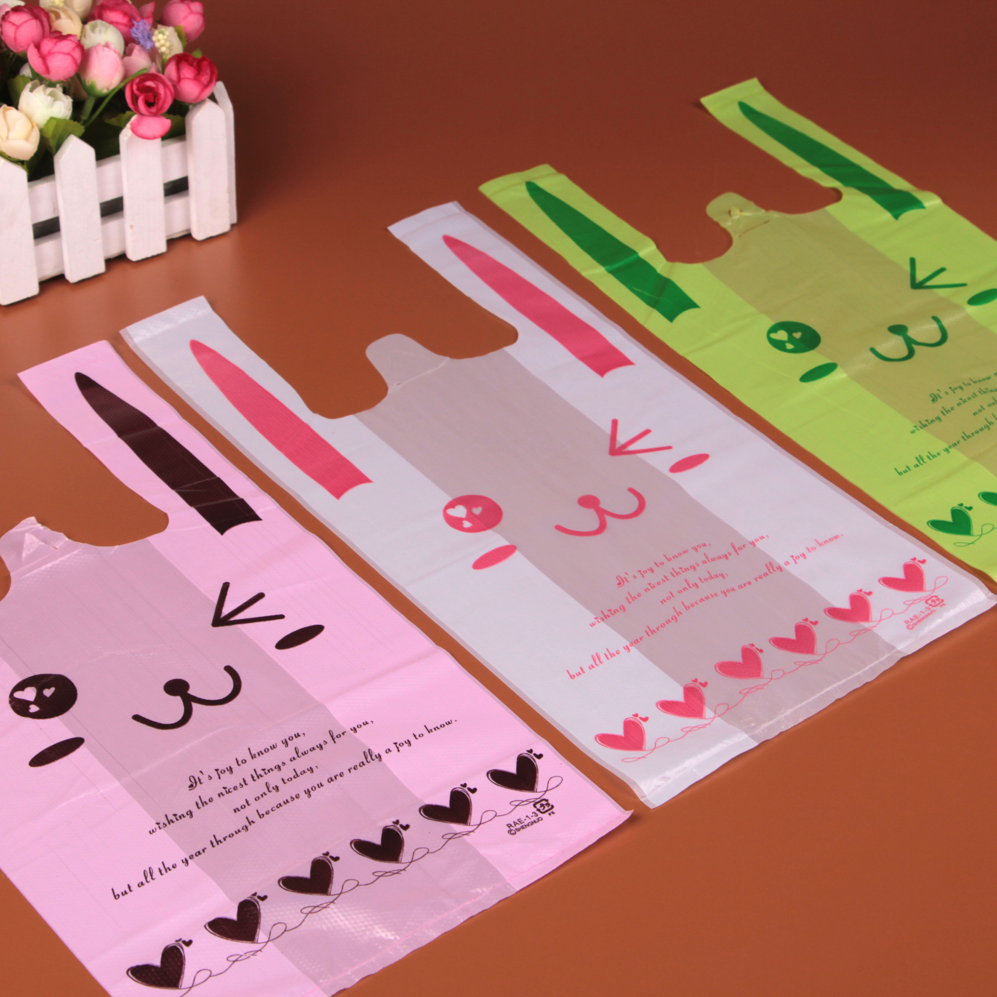 粉色大中小袋子购物袋购物超市塑料袋小号大中笑脸礼品袋