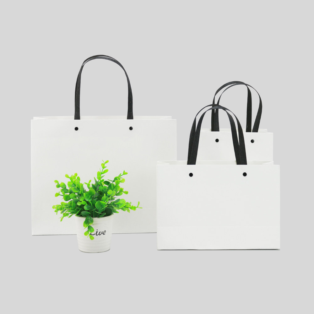 白色敲钉礼品袋彩印卡纸服装手提袋礼品包装纸袋定制礼品袋
