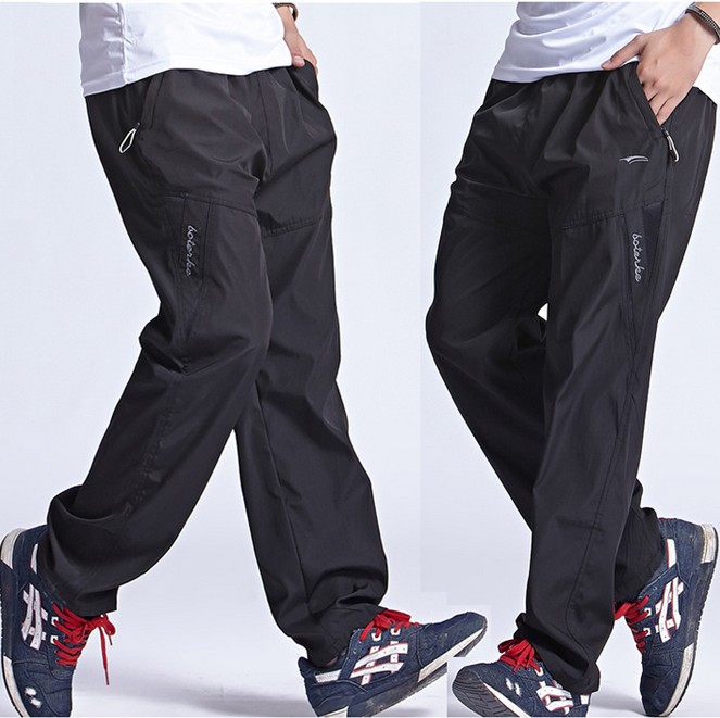 加肥加大涤纶运动裤男防风速干防晒直筒宽松大码光面加网休闲长裤