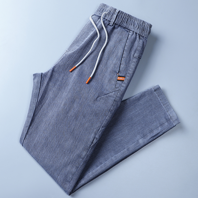 外贸剪标尾货纯棉男士牛仔裤子修身小脚春秋新品松紧腰透气长裤潮