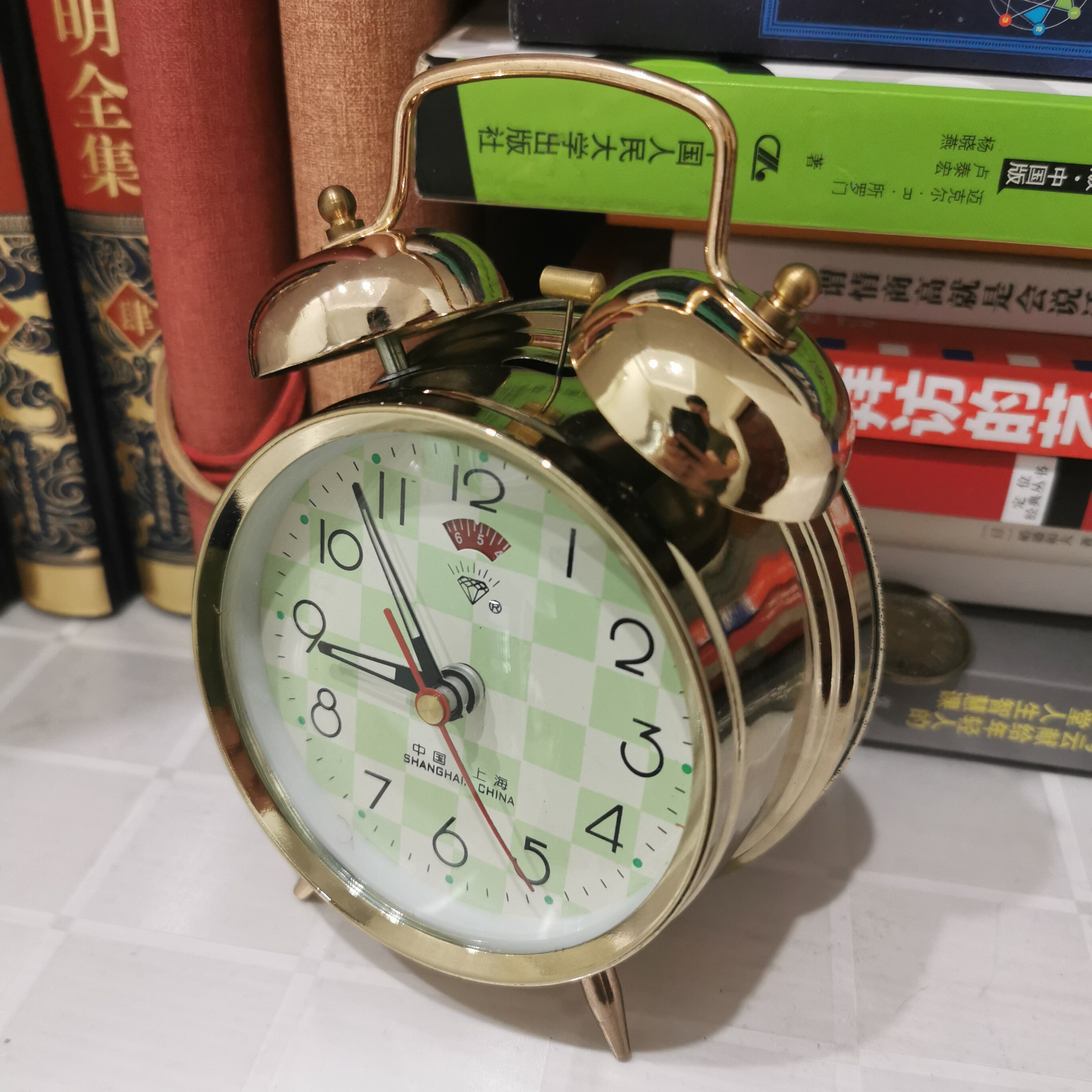 闹钟上海钻石牌90年代收藏夹板半铜机芯机械手动台钟