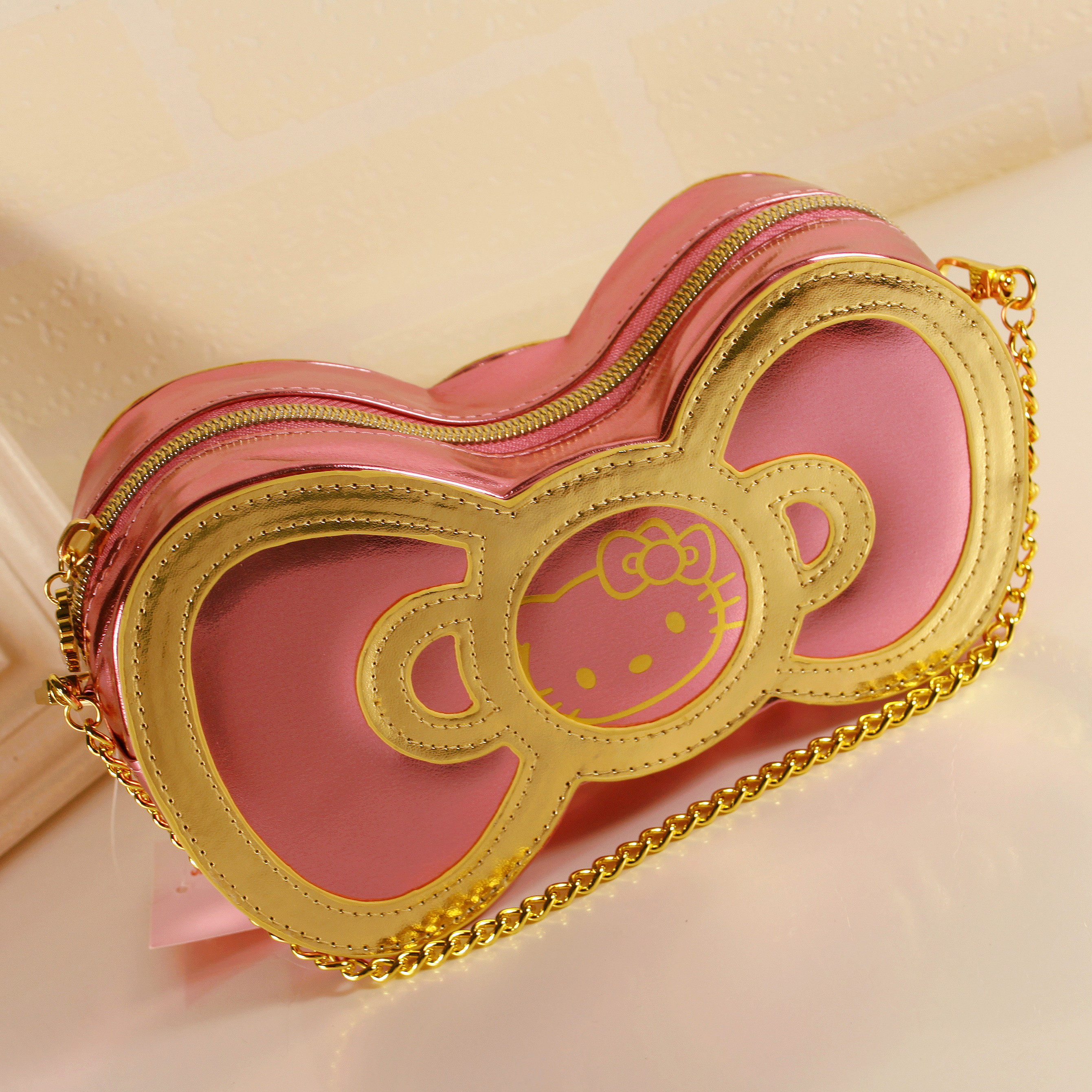 新款hello kitty蝴蝶结零钱包多功能包 明星杂志款手拿化妆包韩版