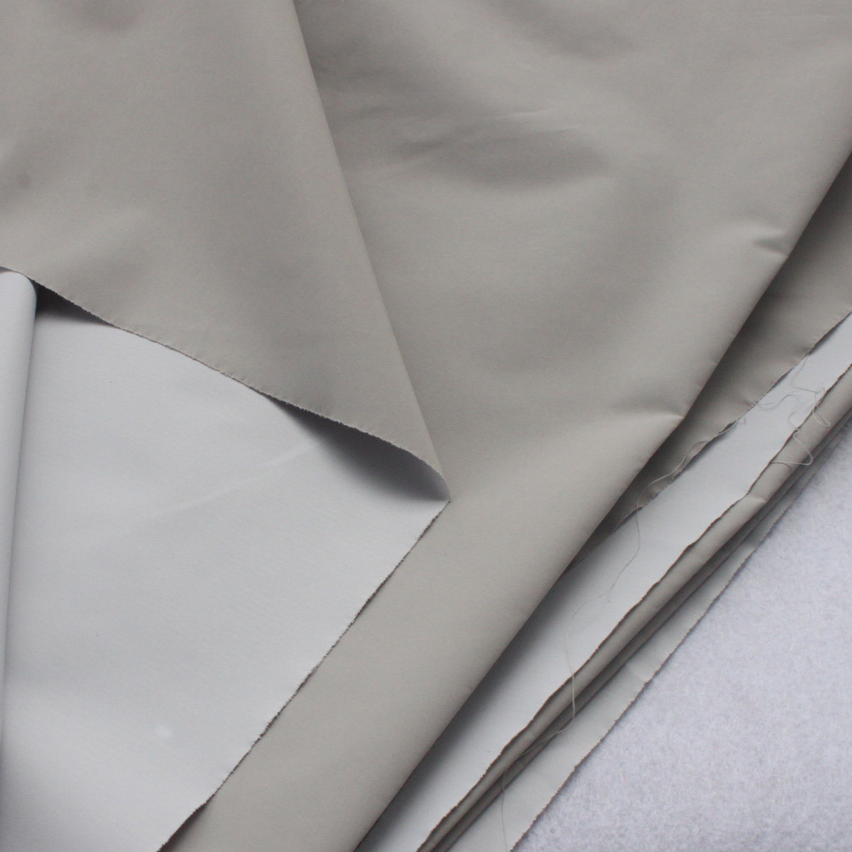 纯色diy手工运动服装pvc防水防潮防雨布风衣面料高密透气防尘布料