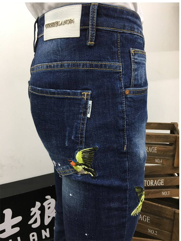 春夏鸟刺绣小脚牛仔裤青年修身显瘦破洞泼墨油漆牛仔长裤男古士狼