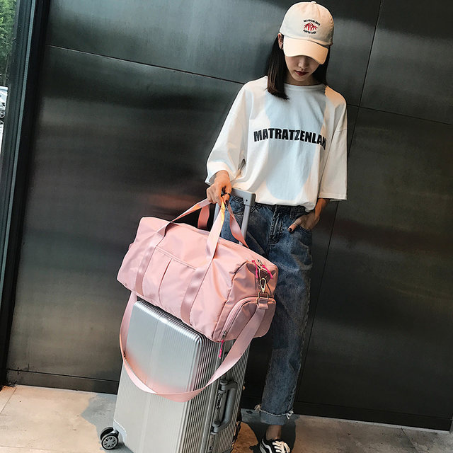 Travel bags, portable luggage bags, short-distance large-capacity women’s short-distance large-capacity can be put on trolley suitcases, clothes bags and bags on the plane Travel bags, portable luggage bags, short-distance large-capacity women’s short-distance large-capacity can be put on trolley suitcases, clothes bags and bags on the plane