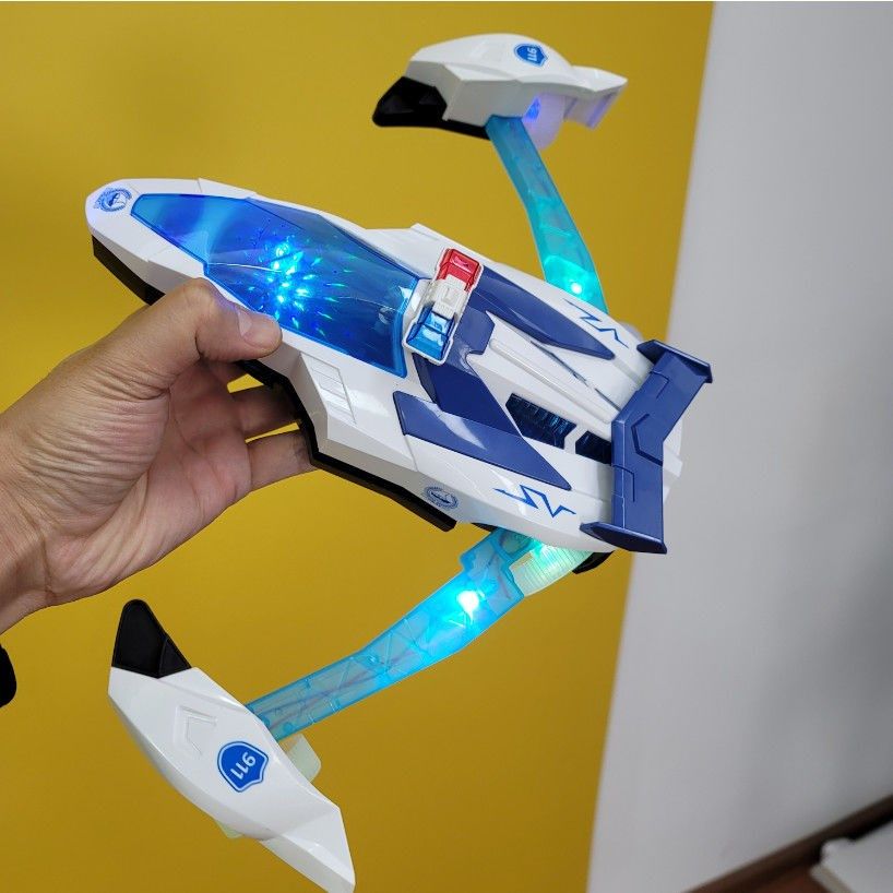 儿童变形玩具万向灯光音乐电动展臂自动飞机电动