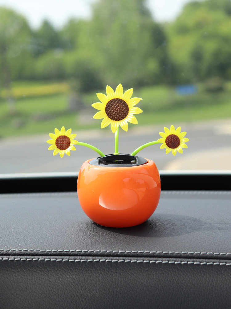 汽车摆件车载香水瓶太阳花摇头中控台装饰用品大全小车内饰品摆件