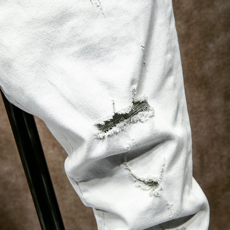 夏季新款米白白色破洞牛仔裤修身小脚漏洞裤子牛仔裤