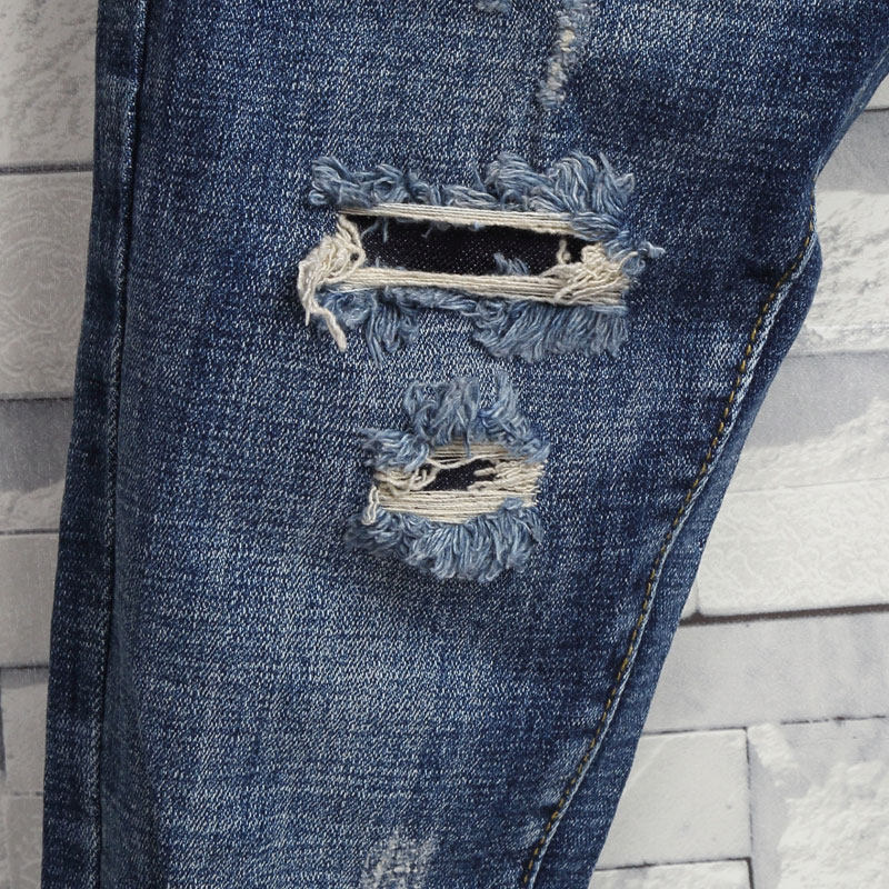 时尚猫须破洞贴布牛仔裤青年韩版修身磨烂裤脚牛仔裤