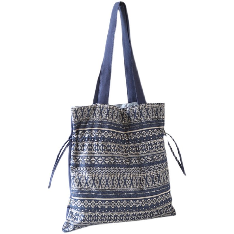 庸庸原创抽绳束口包女单肩包复古帆布包民族风小众设计布包大学生