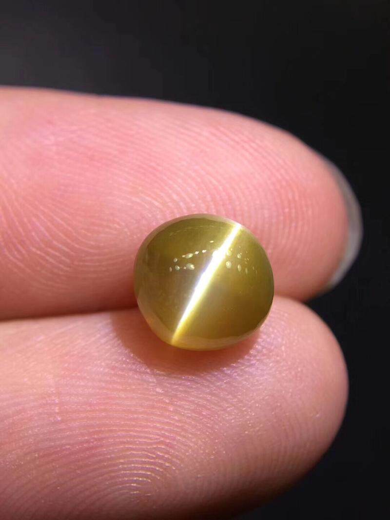 天然无烧圆形蜜糖色金猫眼裸石戒面242克拉国际珠宝奇石