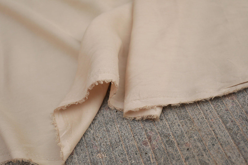 特价意大利进口重磅米色铜氨丝天丝棉布料裤子布面料