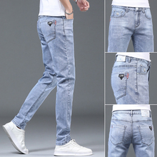 New light toned slim fit men's jeans with small feet