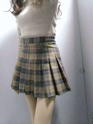 裙子收到了，面料很柔软，不起球，大小合适，穿着特别显腿长，和图片颜色一样，格子裙子很好搭配，价格又便宜，物流也很快，非常满意