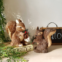 Wide-tailed squirrel forest grass weeds Christmas pine cone decoration storefront wedding window ornaments