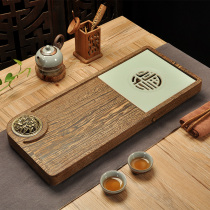 Whole piece of chicken wing wood tea tray Incense road Modern simple ebony solid wood tea tray Tea sea tea table dry bubble table Ruyao porcelain
