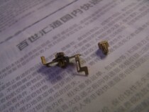 Mechanical alarm clock wire bearing a set of two glass eyes - new machine removal