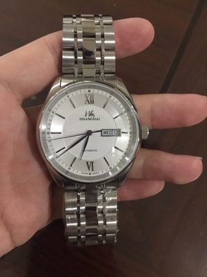 解说男生戴上海手表怎么样,这个牌子上档次吗?是名牌吗?