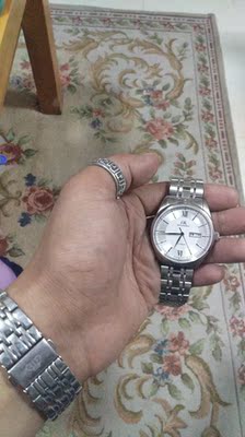 解说男生戴上海手表怎么样,这个牌子上档次吗?是名牌吗?